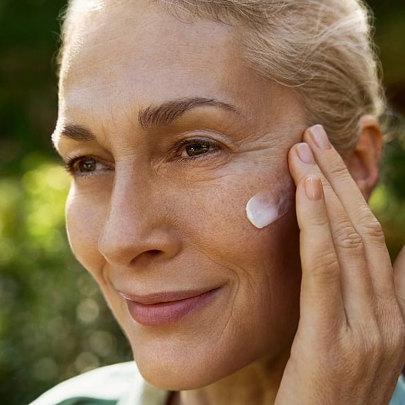 woman applying face cream